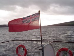 Crossing Loch Lomond with an approaching winter's storm Wallpaper