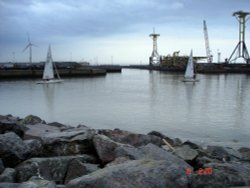 Boats entering into sea.. Wallpaper