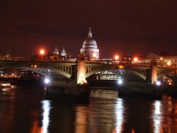 St. Paul's Cathedral from the river Thames at night Wallpaper