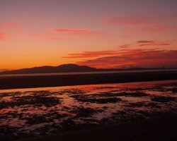 Sunset over Solway as seen from shoreline Blitterlees Silloth Wallpaper