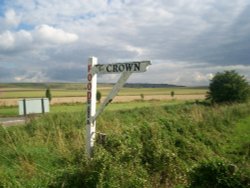 Fingerpost pointing to one of the pubs at Broad Hinton, Wiltshire
