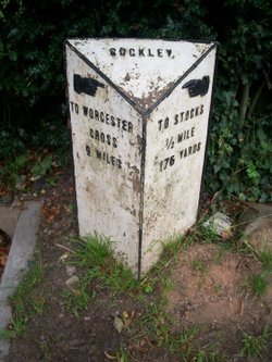 Cast-iron milestone with pointing hands at Suckley, Worcestershire