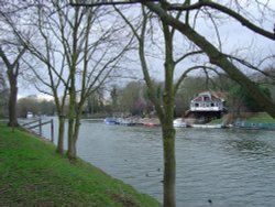 River Thames in Weybridge, Surrey. In summer the people walk around and trip in boat. Wallpaper