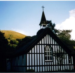 The front of the little thatched church at Little Stretton, Shropshire Wallpaper