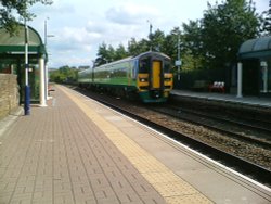 The Leeds To Blackpool train rushes through Oswaldtwistle Station Wallpaper