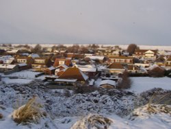 view of Camber, East Sussex from the Sand dunes. Looking over to Romney Marsh Wallpaper