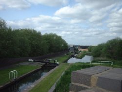 Twelve step lock stairway in Oldbury, West Midlands, carrying canal beneath M5 near junction 2. Wallpaper