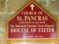 Sign of St. Pancras church, Widecombe in the Moor, Devon. Wallpaper