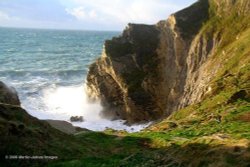 Dorset, Lulworth Cove, Stair Hole seas breaking in high wind Wallpaper