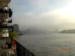 Foggy view of Canary Wharf from a warehouse conversion in Limehouse E14 Wallpaper