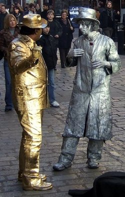 Living Statues passing the time of day at Covent Garden, Greater London.