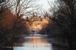 Evening view from Buckingham Palace along the lake in St James Park to Whitehall and Horseguards. Wallpaper