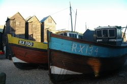 Boats by the net sheds at Hastings, East Sussex Wallpaper