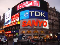 Piccadilly Circus, in Mayfair, at night. Wallpaper