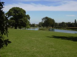 View across the upper and middle lakes at Cusworth Hall & Museum, South Yorkshire Wallpaper