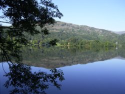 September morning reflections on Grasmere, Cumbria Wallpaper