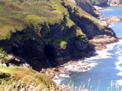 Boscastle caves in cliff Wallpaper