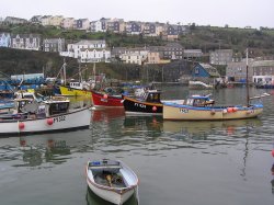 Boats in Mevagissey harbour at high tide Wallpaper