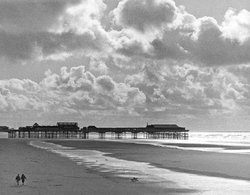 The pier and beach in October Wallpaper