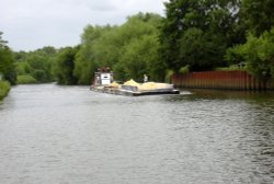 Workboat and barges entering the lock cut past the Boat Inn Wallpaper