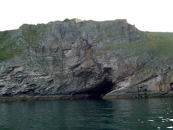 Berry Head seen from the sea showing the colours in the cliff. Wallpaper