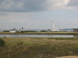 Hurst Lighthouse on a cloudy day Wallpaper