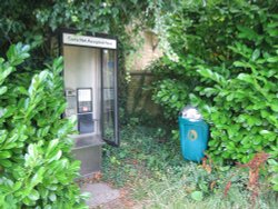 Modern phone box well hidden away in Weston on the Green Wallpaper