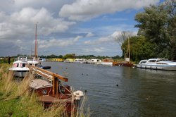 Boats moored on a Broad in Norfolk Wallpaper