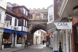 Medieval gate near postcard shop Wallpaper