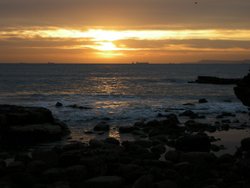 Sunrise on the light house corner Wallpaper