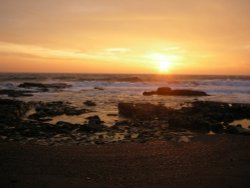 Sunrise on the light house corner Wallpaper