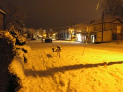 Late evening February 2009 the snowy High Street, bathed in the orange light of the street lamps