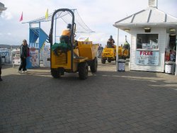 Dump trucks on the pier. Wallpaper