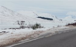 Loch Droma covered with ice and snow Wallpaper