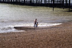 Father and son on Hastings beach. Wallpaper