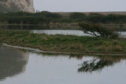 Cliffs reflected on the water Wallpaper