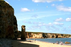 The beach and cliffs at Marsden Bay. Wallpaper