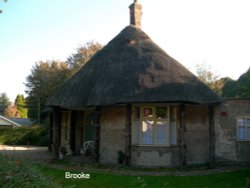 A small thatched building Wallpaper