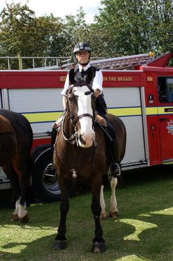 Posing in front of a Fire Engine.