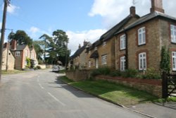 The main street in Ravenstone looking up towards the Church. Wallpaper