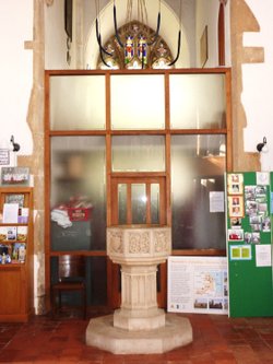 The Font, Bellropes and a section of the stained glass window