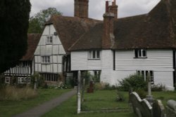 Churchyard and cottages Wallpaper