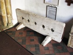 Old Stocks in St. Margarets South Elmham Church Porch Wallpaper