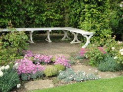 A peaceful corner of the gardens at Castle Howard Wallpaper