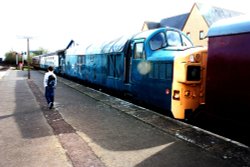 The lonely traveller at Dereham station Wallpaper