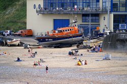 Lifeboat on the beach. Wallpaper