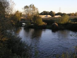 Kennet at Thatcham with fresh spoil heaps in the background Wallpaper