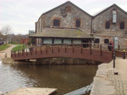 Wooden pedestrian bridge through the River Exe. Wallpaper