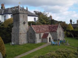 Model of All Saints Church at Godshill Model Village. Wallpaper