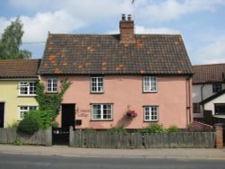 A Suffolk pink house in the street Wallpaper